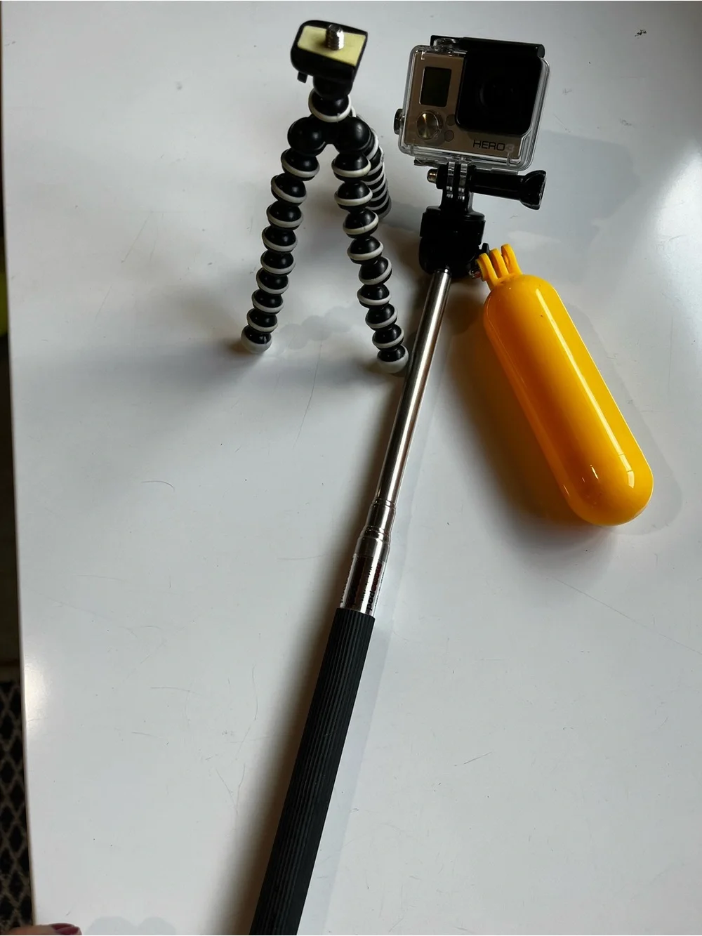 GoPro HERO 3 with Yellow Floating Hand Grip and Black/White Flexible Tripod
